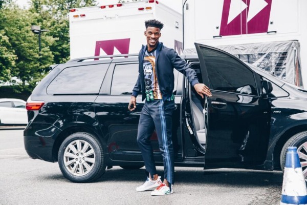 Jimmy Butler is coming out of his car, Toyota Sienna. 